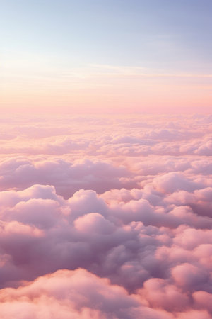 Aerial view of Beautiful sunrise sky above clouds or fog with dramatic light at dawn.の素材