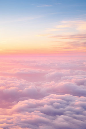 Aerial view of Beautiful sunrise sky above clouds or fog with dramatic light at dawn.の素材