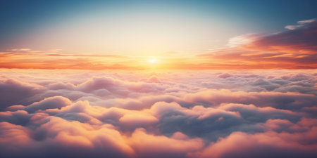 Aerial view of Beautiful sunrise sky above clouds or fog with dramatic light at dawn.の素材