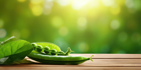 Green pea pod, green peas on the wooden floor with natural bokeh background.の素材