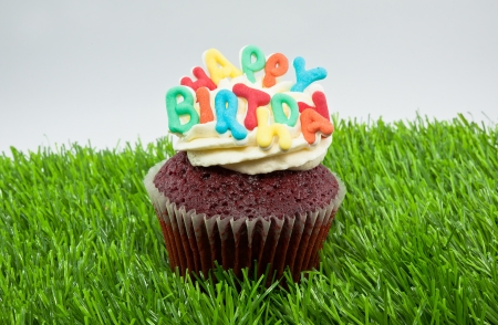 Cupcake decorated with birthday candlesの写真素材
