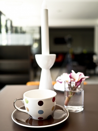 cup with flowers on  dark background の写真素材