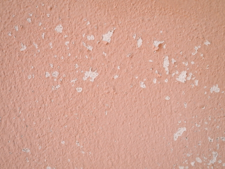 An orange grunge wall with a ropeの写真素材