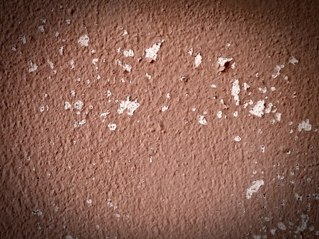 An orange grunge wall with a ropeの写真素材