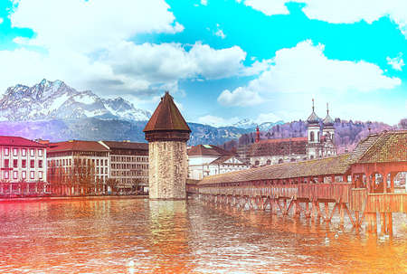 LUZERN, SWITZERLAND - APRIL 11:Chapel bridge famous place on lake Luzern with snow mountain behide, APRIL 11,2015, Lucerne, Switzerland. Chapel bridge famous place on lake Lucerne Switzerland, Europe.のeditorial素材