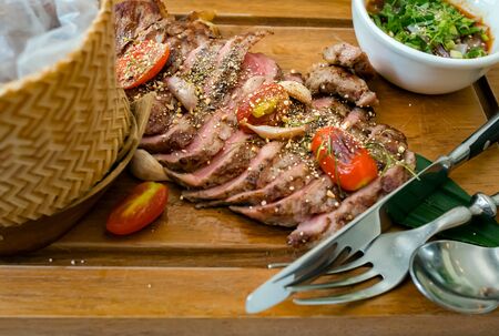 Thai-style grilled beef with Thai spicy sauce.の写真素材