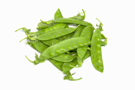 fresh sugar snap peas on white backgroundの写真素材
