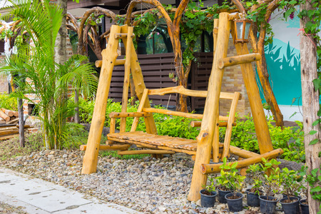 wood swing in the gardenの写真素材