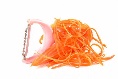 carrot slicer isolated on whiteの写真素材