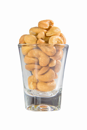 cashew nuts in a glass isolatedの写真素材