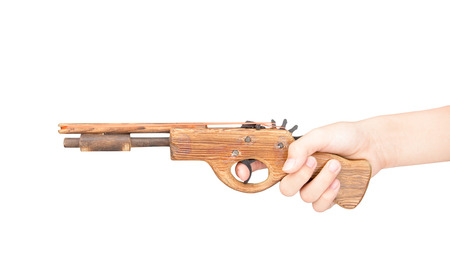 Toy gun made of wood isolated on white backgroundの写真素材