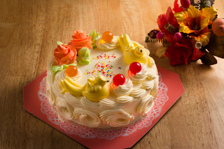 Cream cake with Jelly on the wooden table