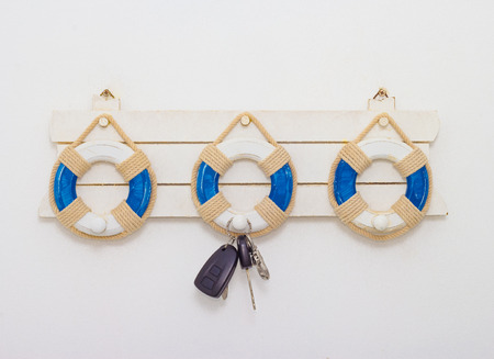 wall hanger with remote car key on white backgroundの写真素材