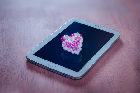 hearts with tablet computer,Valentines Day, vintage color.の写真素材