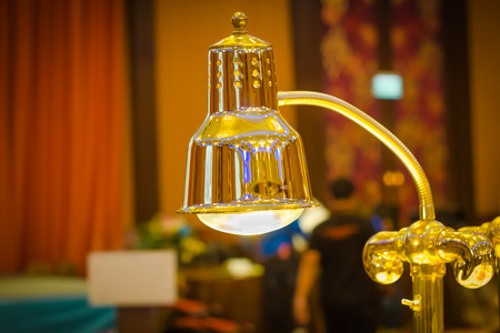 gold metal table lamp in hotelの写真素材