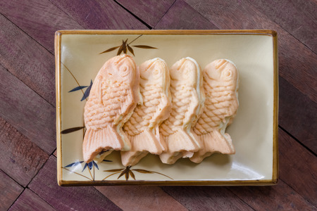 Taiyaki cakes on wood background,Japanese confectioneryの写真素材