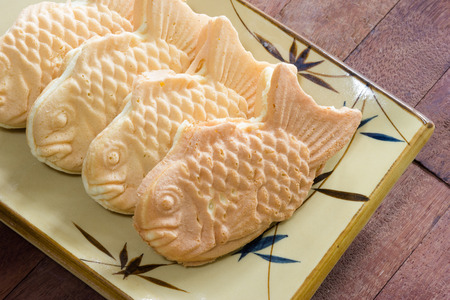 Taiyaki cakes on wood background,Japanese confectioneryの写真素材