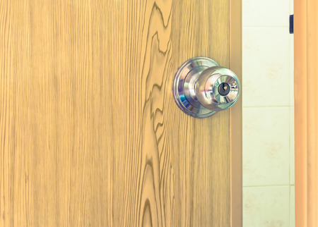 steel door knob on the pvc door,vintage effect filterの写真素材