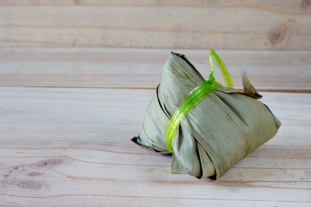 zongzi or Bak Chang on wood backgroundの写真素材