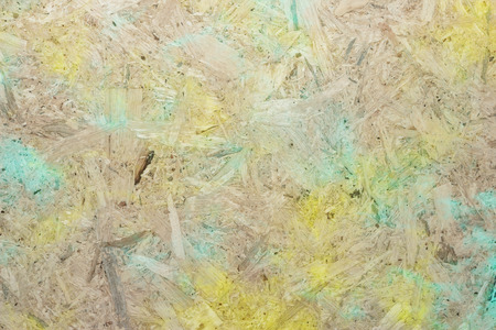 Close-up of pressboard background with green yellowの写真素材
