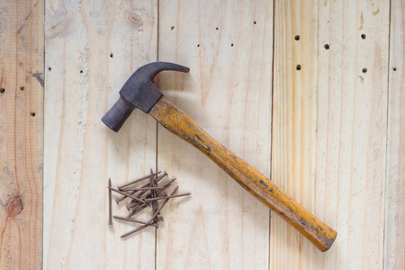 Hammer and nails on wood backgroundの写真素材