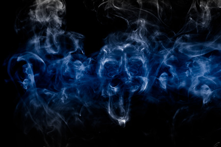 Smoke-shaped ghost,black backgroundの写真素材