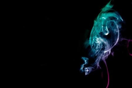 Smoke-shaped ghost,black backgroundの写真素材