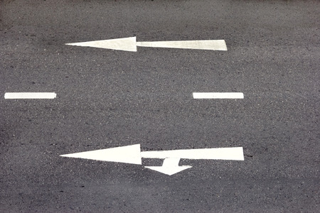 high angle of the road with white arrow.