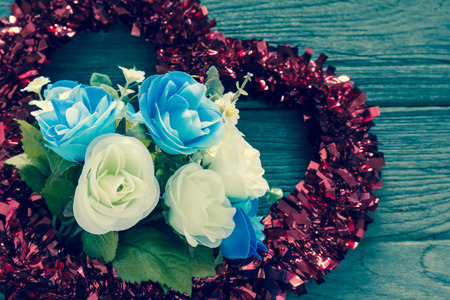 Rose with Tinsel heart  decoration,filter effect.の写真素材