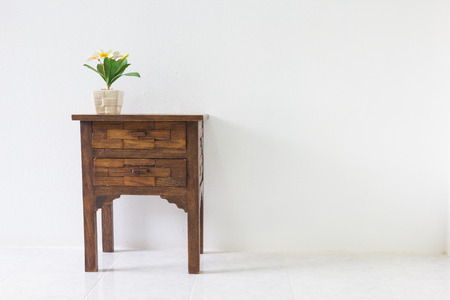 brown wood table in white room.の写真素材