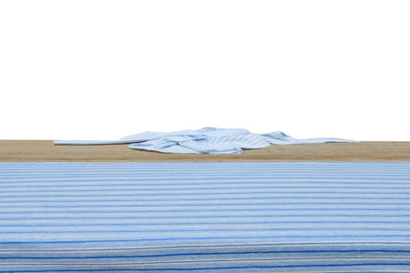 Wooden table with fabric isolated on white