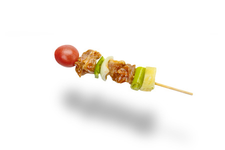 skewer of mixed meat and vegetables isolated on white backgroundの写真素材
