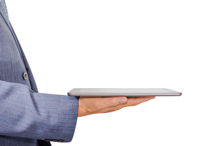 Hand holding white tablet computer isolated on white backgroundの写真素材