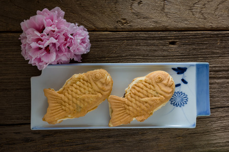Taiyaki cakes on wood background,Japanese confectioneryの写真素材
