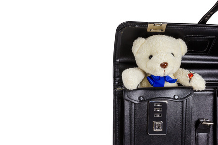 Black retro leather schoolbag with teddy bear isolated on white background,clipping pathの写真素材