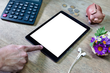 Man using tablet computer on desktopの写真素材
