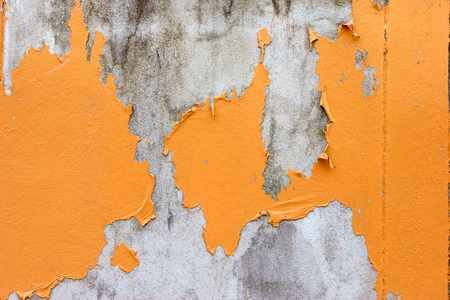 Old peeling paint wall,orange colorの写真素材