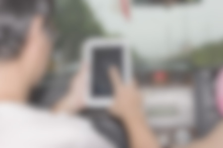 using tablet computer blur background of Illustration,Abstract Blurred