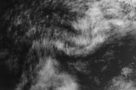 Textured cloud,Abstract black,isolated on black backgroundの写真素材