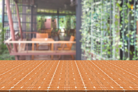 Top desk with blur restaurant background,wooden table
