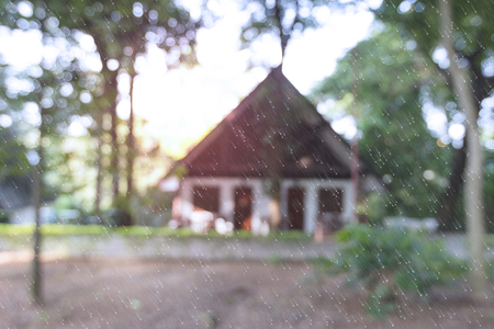 Blurry house with snow in the forest backgroundの写真素材