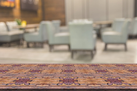 Top desk with blur restaurant background,wooden table