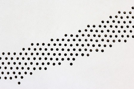 metal plate with holes on floor,abstract patternの写真素材