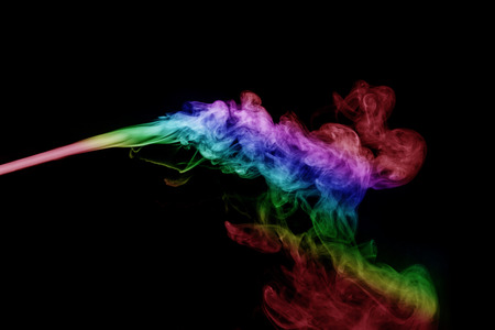 Abstract smoke isolated on black background,Rainbow powderの写真素材