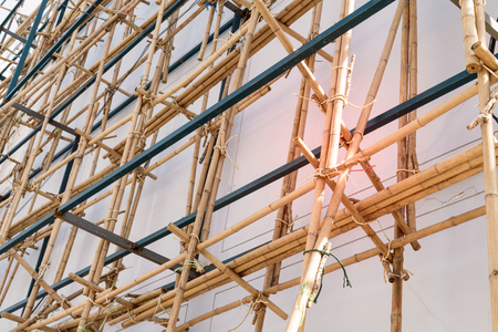 scaffolding at construction with wooden bambooの写真素材
