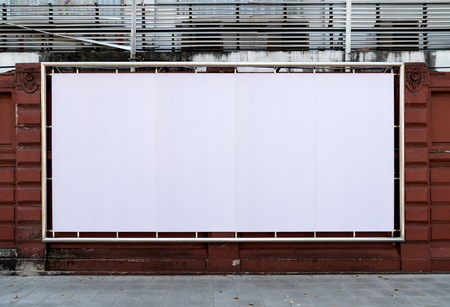 white billboards hanging on wall の写真素材