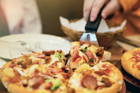 closeup person eating pizzaの写真素材