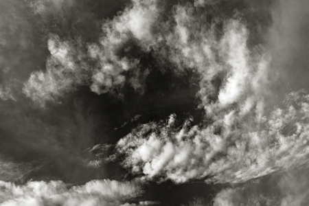 sky with black and white cloud textured backgroundの写真素材