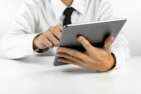 Businessman using tablet on white backgroundの写真素材