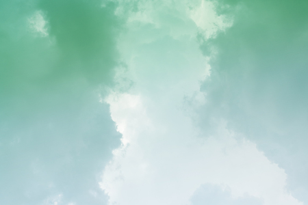 White cloud and green sky background with copy spaceの写真素材